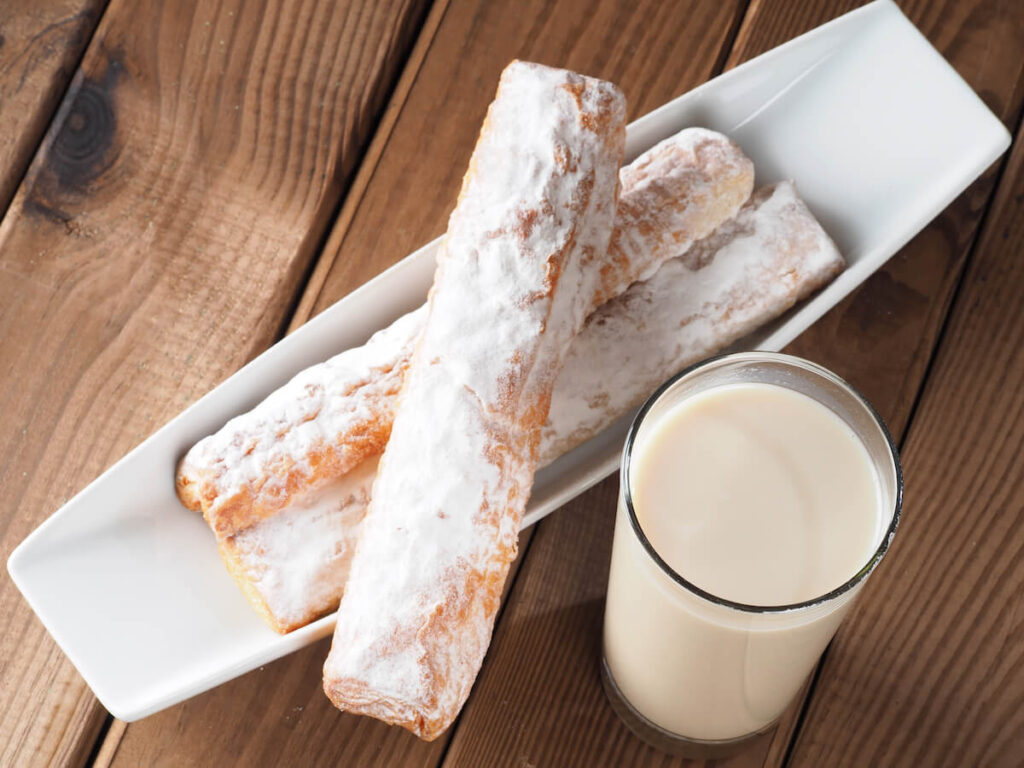 glass of horchata de chufa with fortons