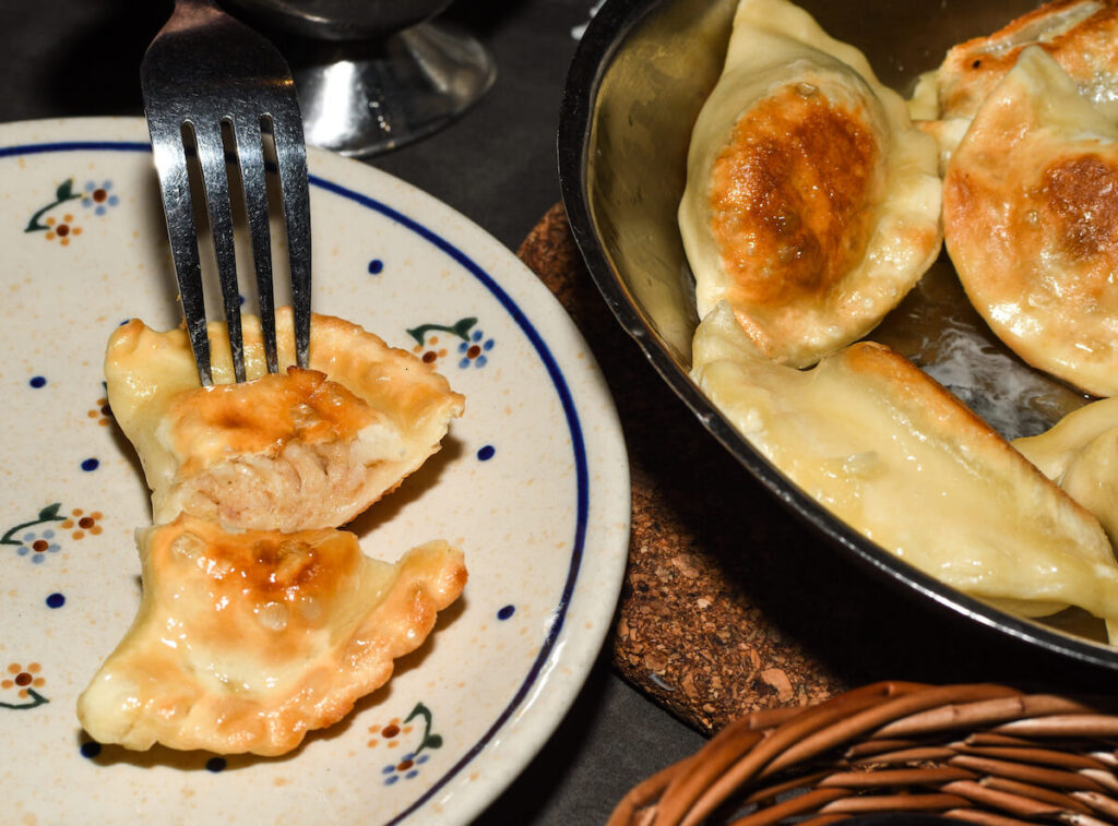 plate and bowl of pierogi, a Polish dish