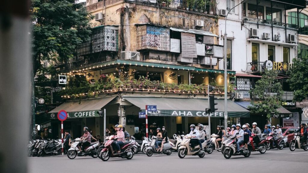 motorcycles passing by street in Old Quarter
