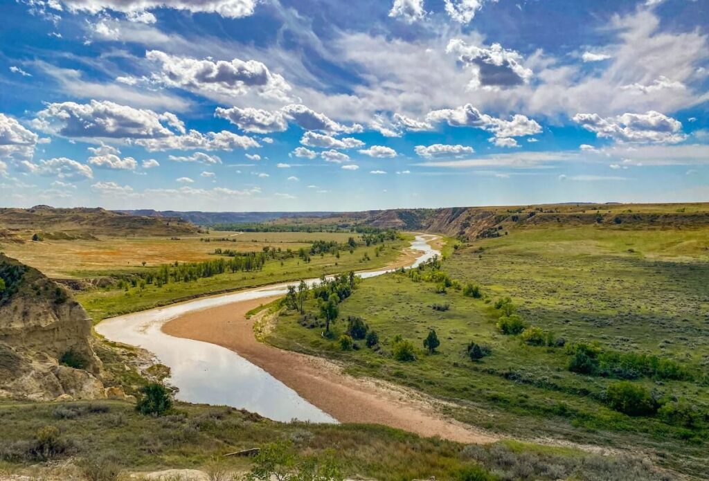 River flowing through green valley
