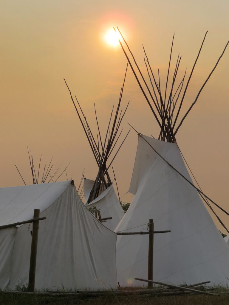 Teepees at sunset