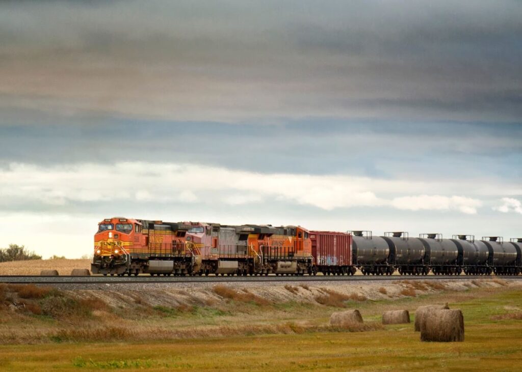Train pulling oil in rural field