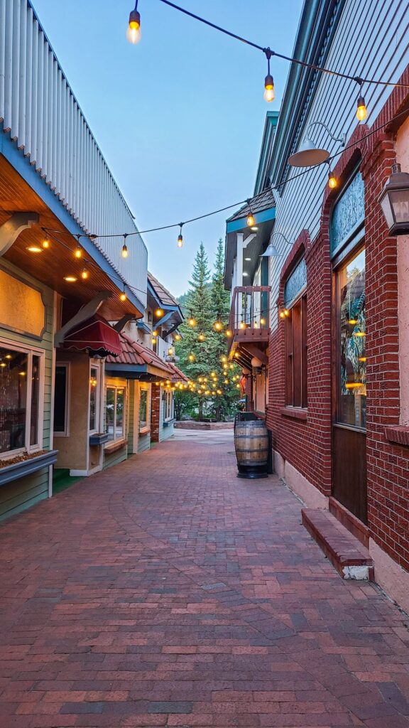 Brick street lined with lights buildings in Estes Park