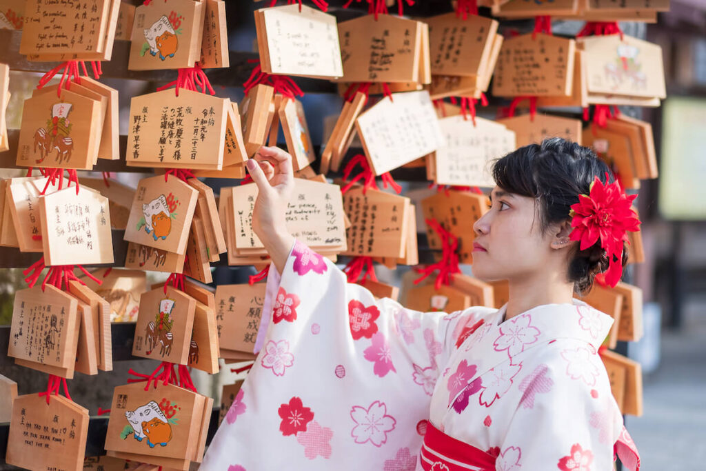 Young woman tourist wearing kimono in Kiyomizu dera temple, Kyoto, Japan