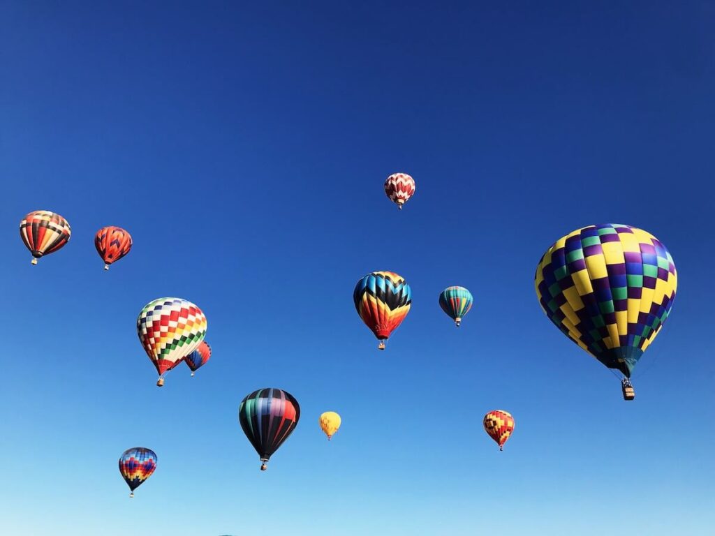 Colorful hot air balloons flying over Pagosa Springs