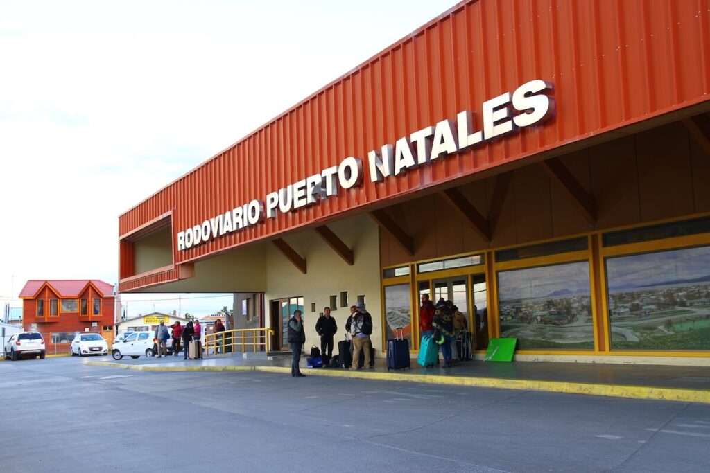 people waiting outside the bus terminal in Puerto Natales