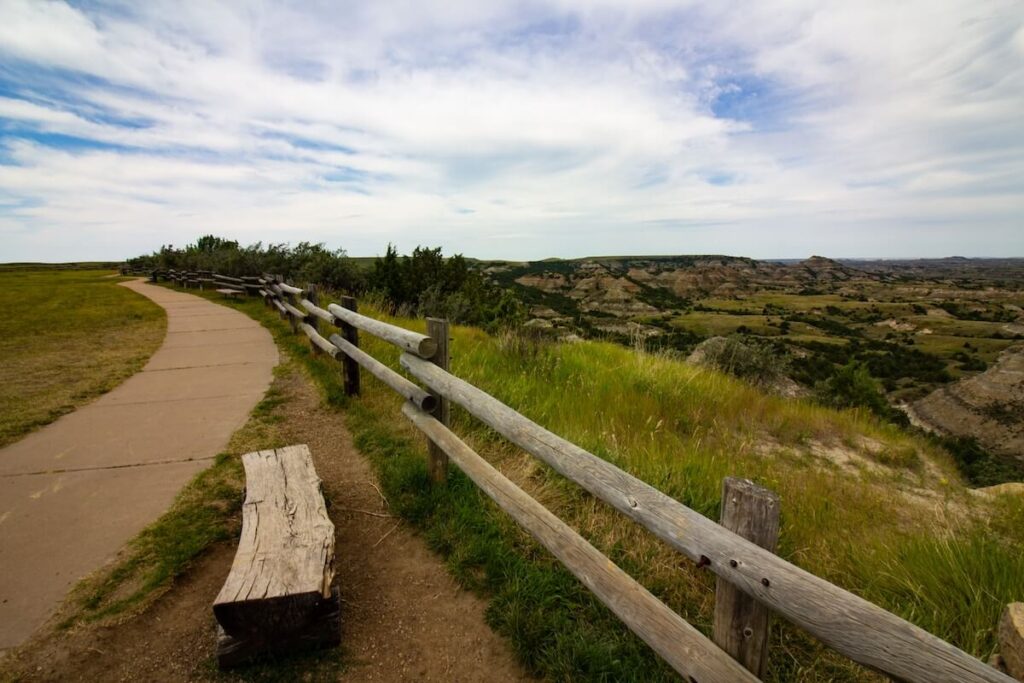 sidewalk near fence by green canyon