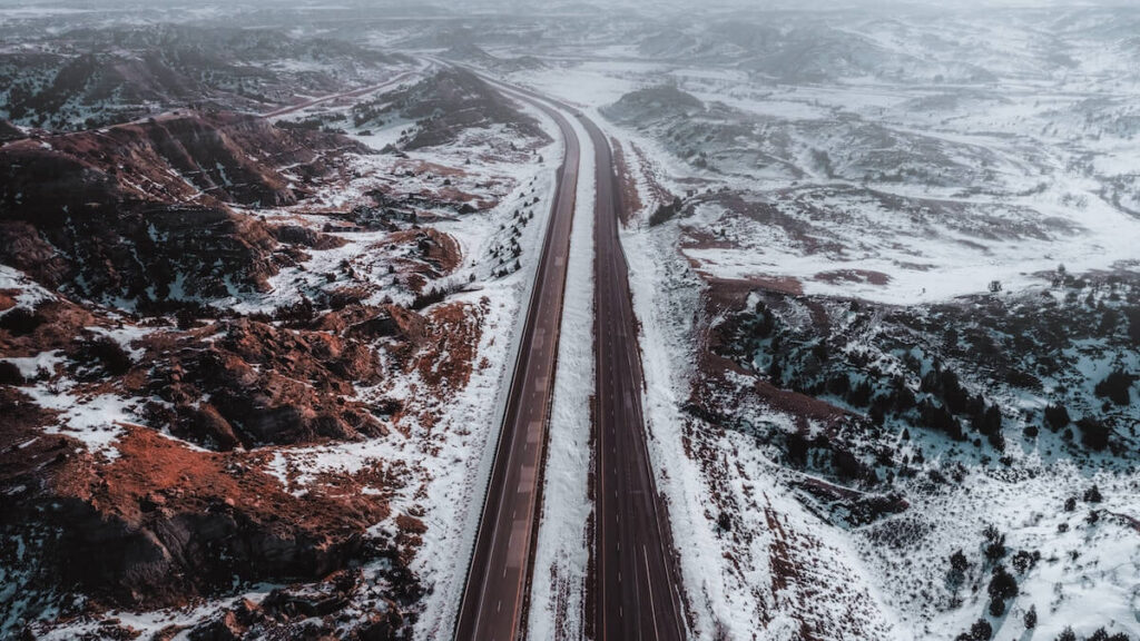 Aerial road in snowy red canyon