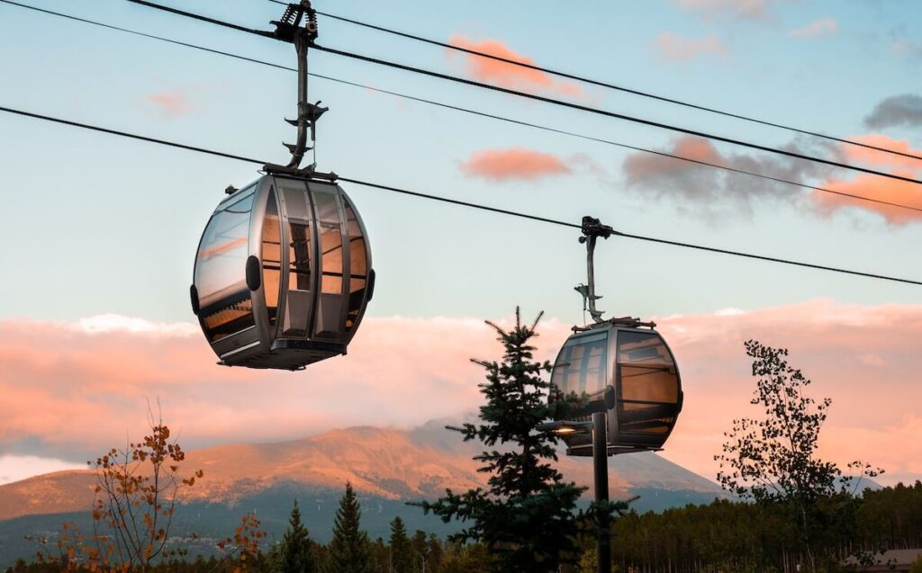 A sunset shot of two gondolas in Steamboat Springs