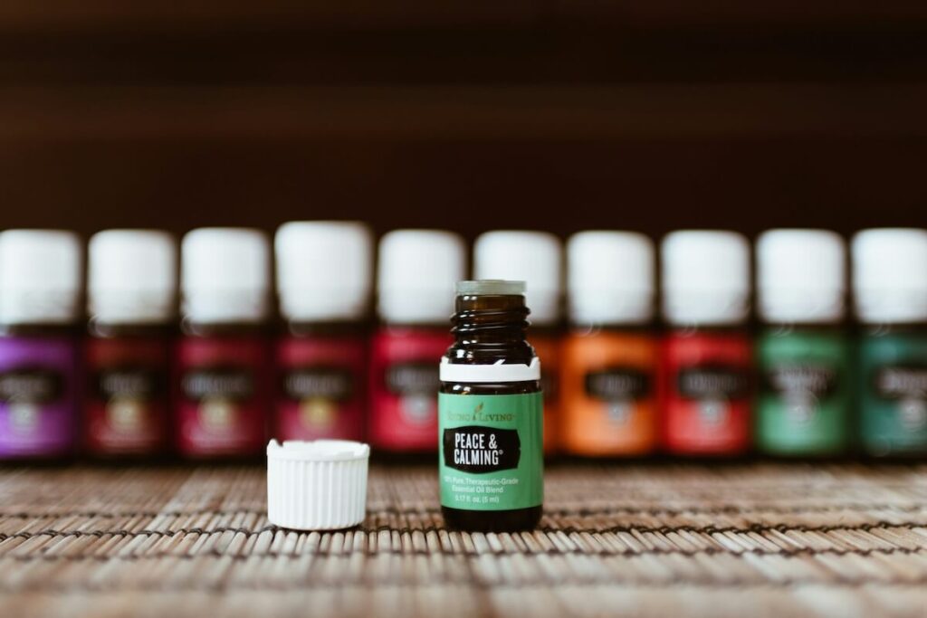a bottle of essential oil with more bottles in the background