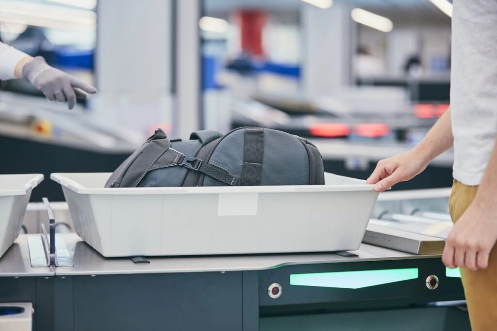 traveler undergoing airport security check