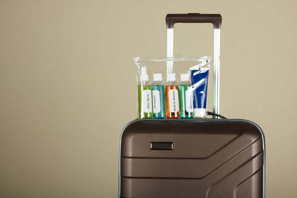 travel luggage with clear pouch of liquids on top