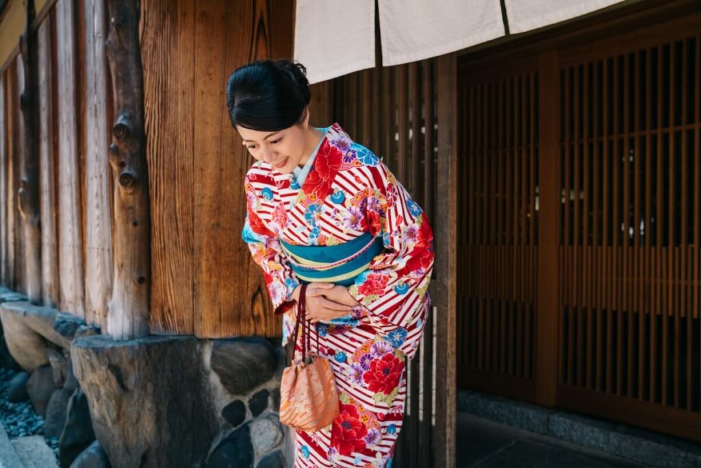 woman wearing kimono bowing