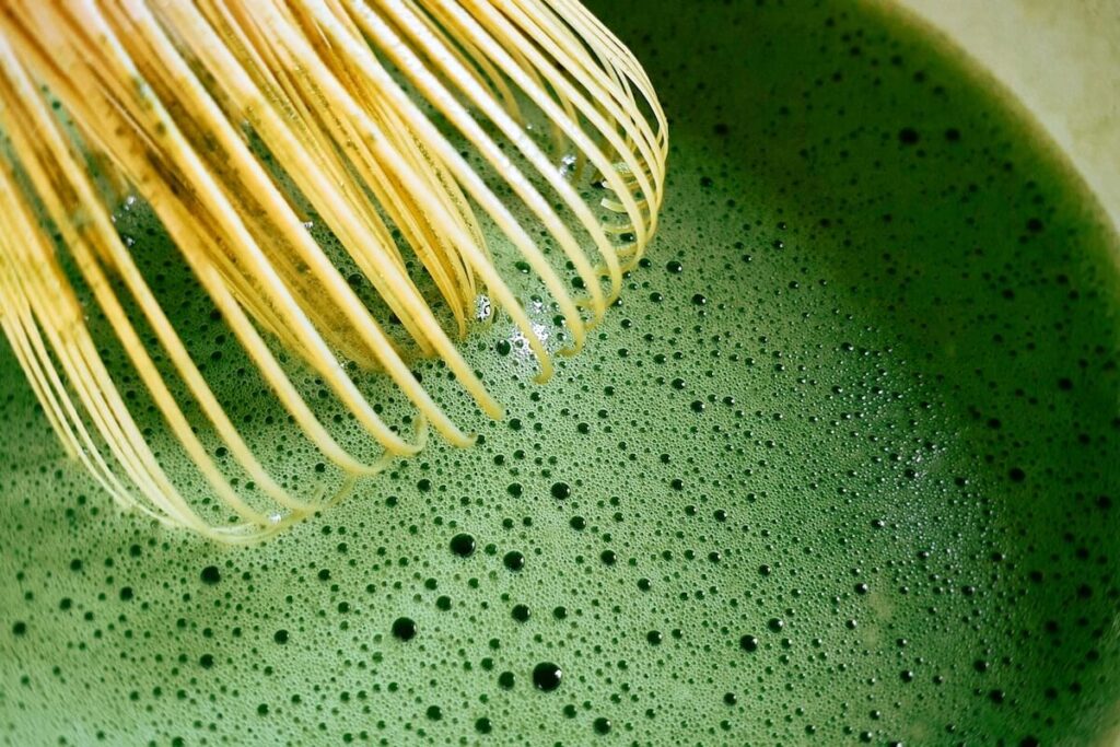 close up of matcha with chasen