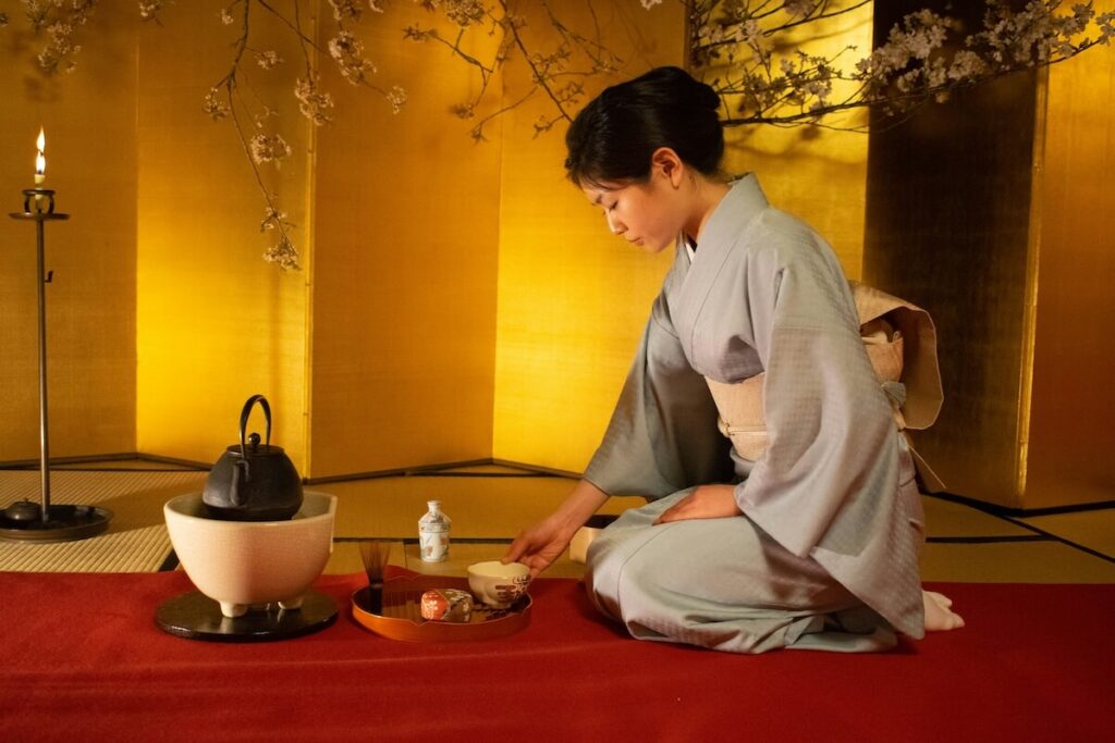 woman hosting Japanese tea ceremony