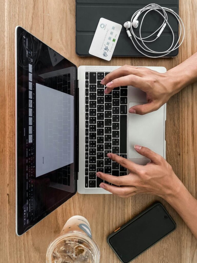 man using laptop in cafe