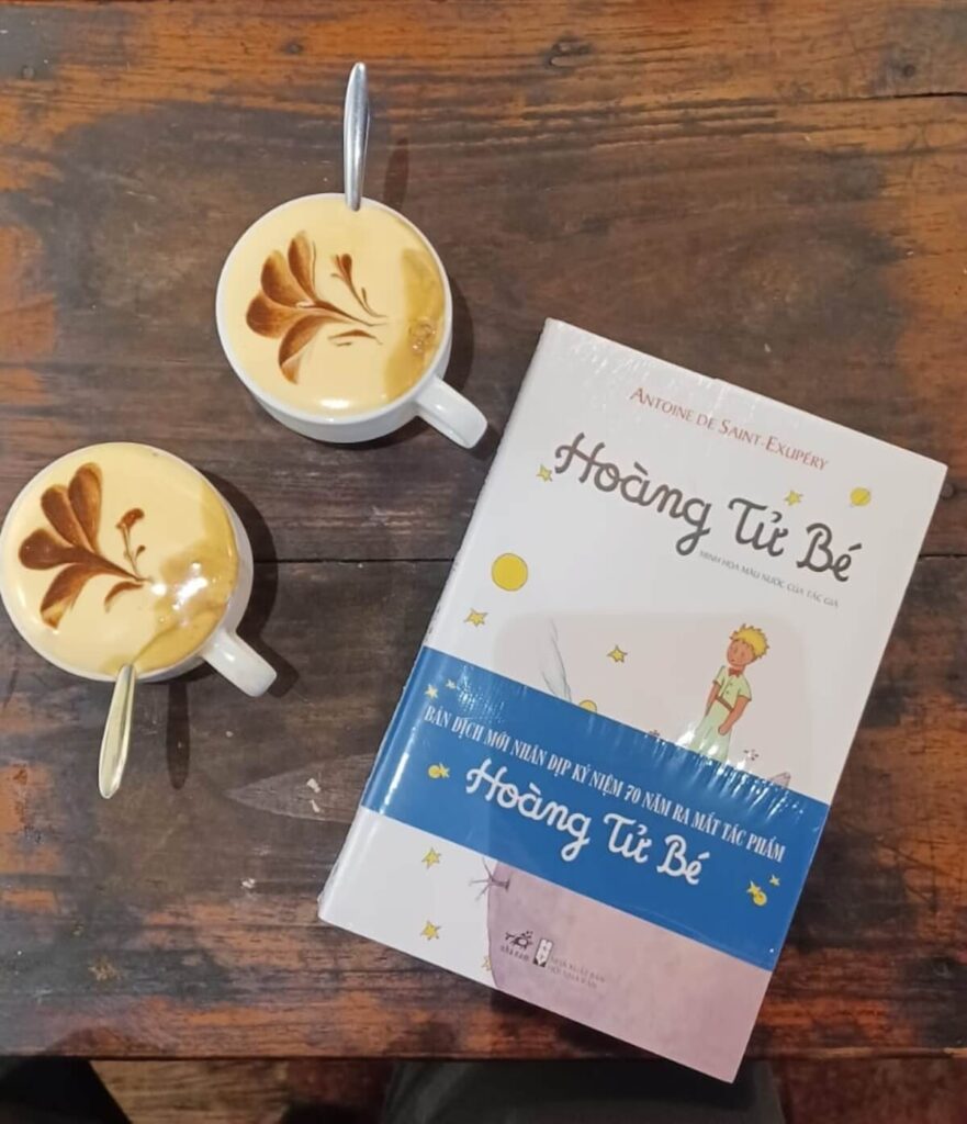 two cups of egg coffee with Vietnamese edition of The Little Prince