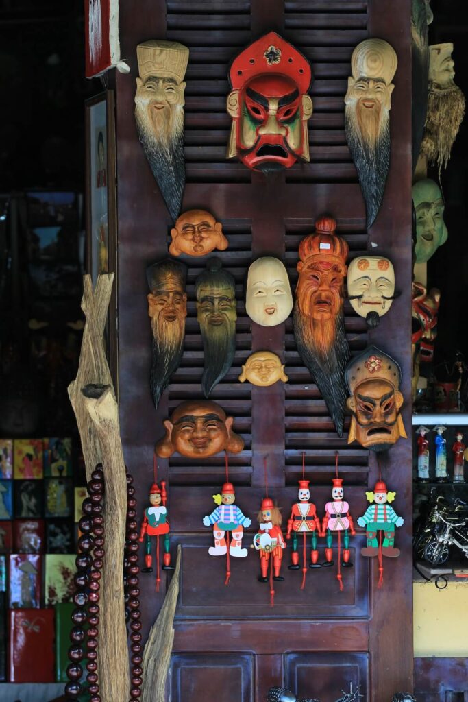 a variety of Vietnamese masks on display