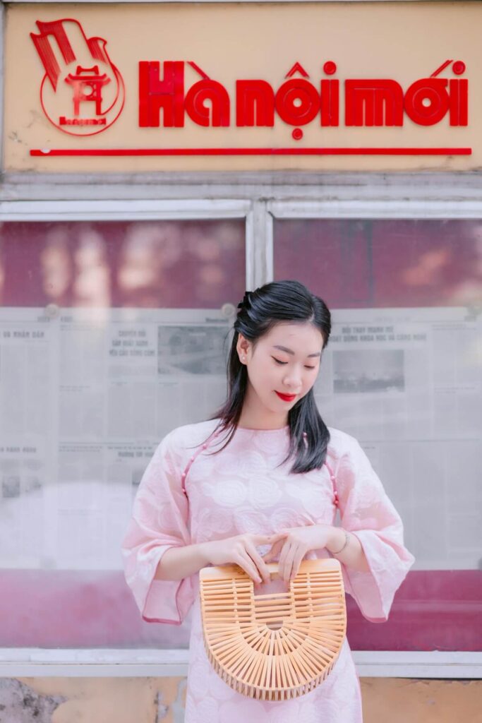 woman holding bamboo bag