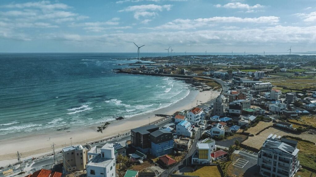 panoramic view of Woljeongri Beach and coastal city in Jeju
