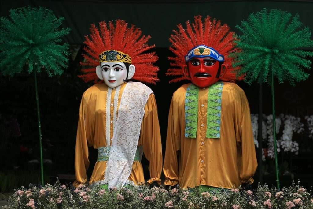 large puppets at a Betawi festival