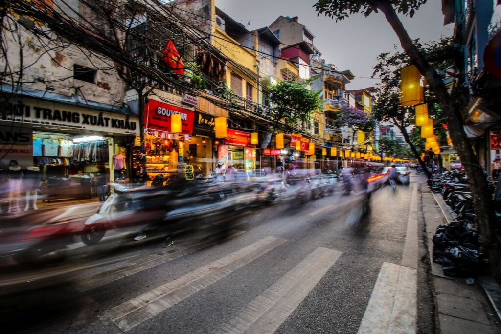 motorcycle passing by streets of Hanoi Old Quarter
