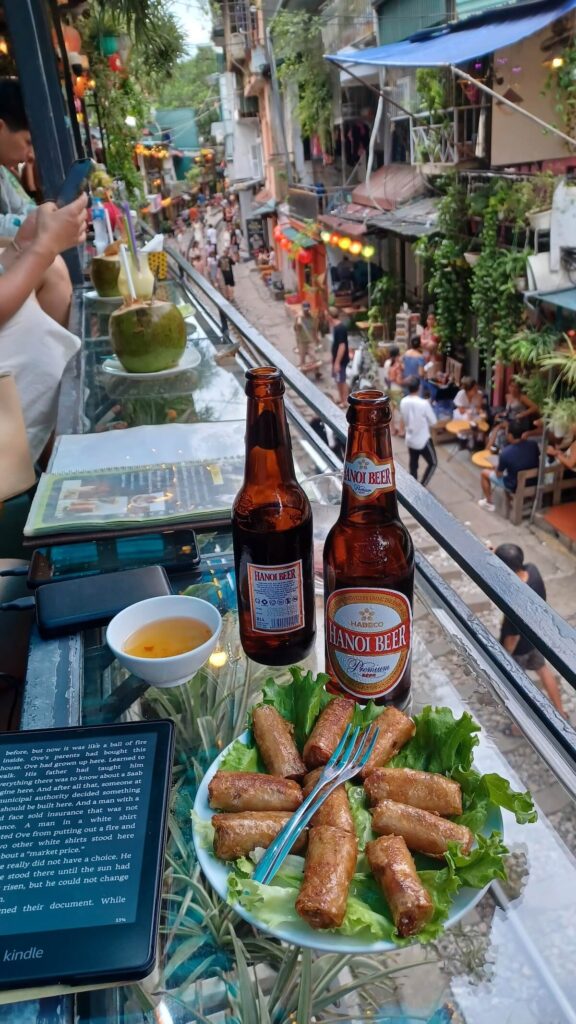 enjoying Hanoi beer and nem at Hanoi Train Street