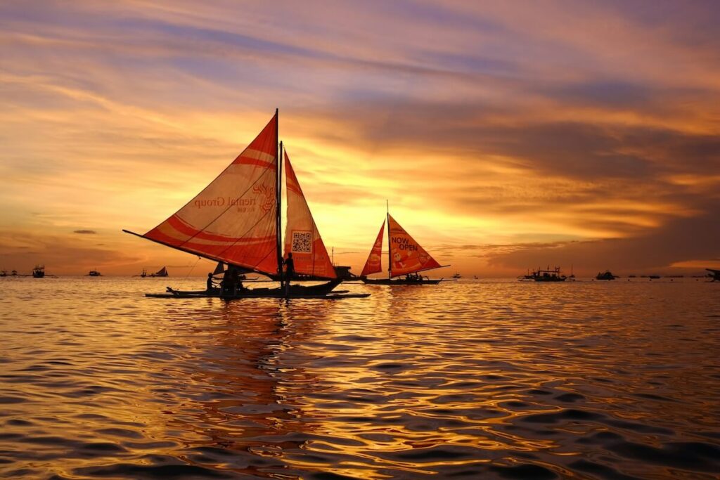 sailboats in Boracay during sunset
