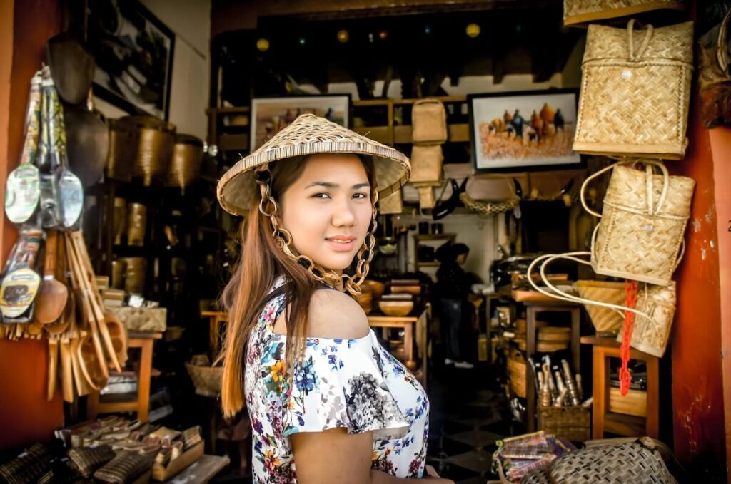 woman posing in front of souvenir shop
