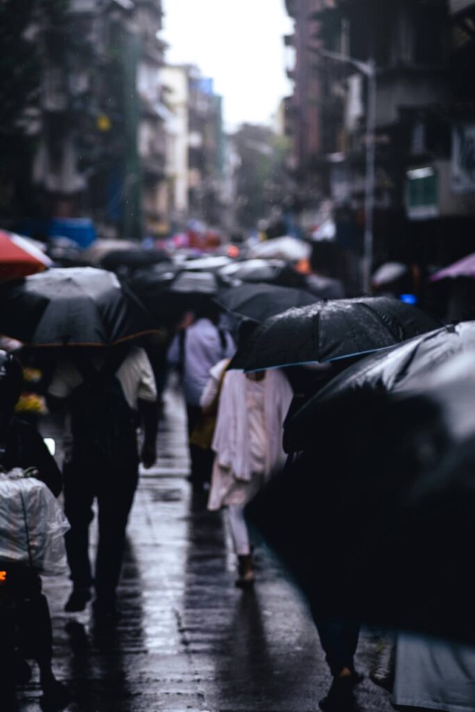 People Walking in Rain in Mumbai