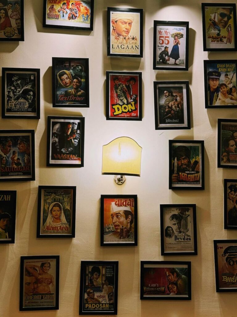 Framed Bollywood Posters on Illuminated Wall