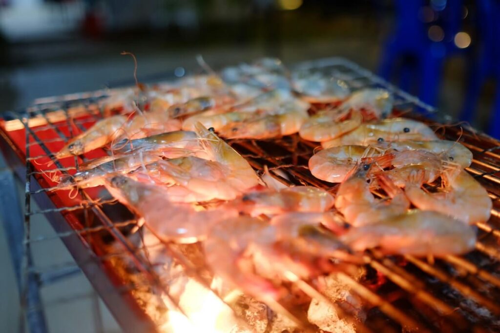 shrimp grilling on fire