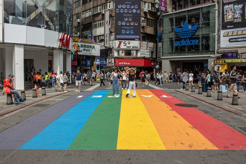 people posing for photos at the Rainbow Six Crossing in Ximending