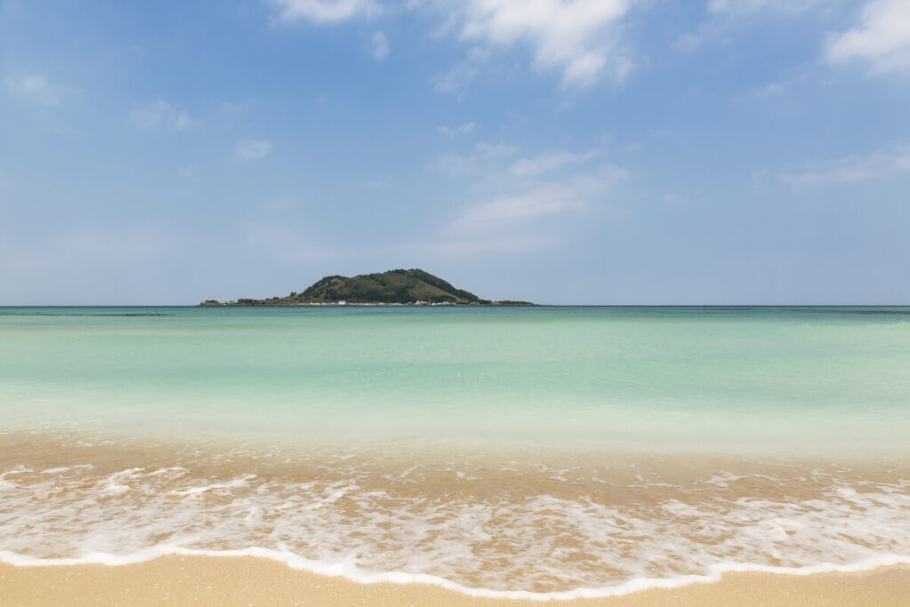 panoramic shot of Hyeopjae Beach with Biyangdo Island seen from a distance