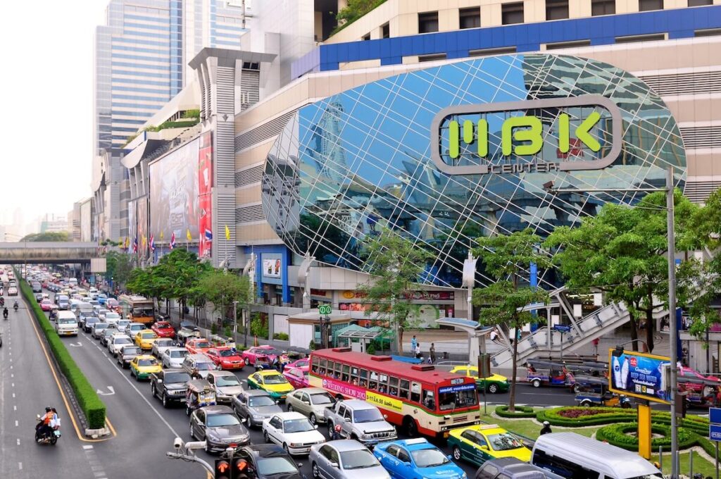 wide view of Bangkok road with MBK Center on one side