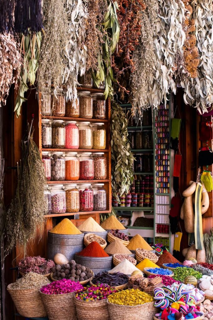 assorted spices on display in a market in Morocco