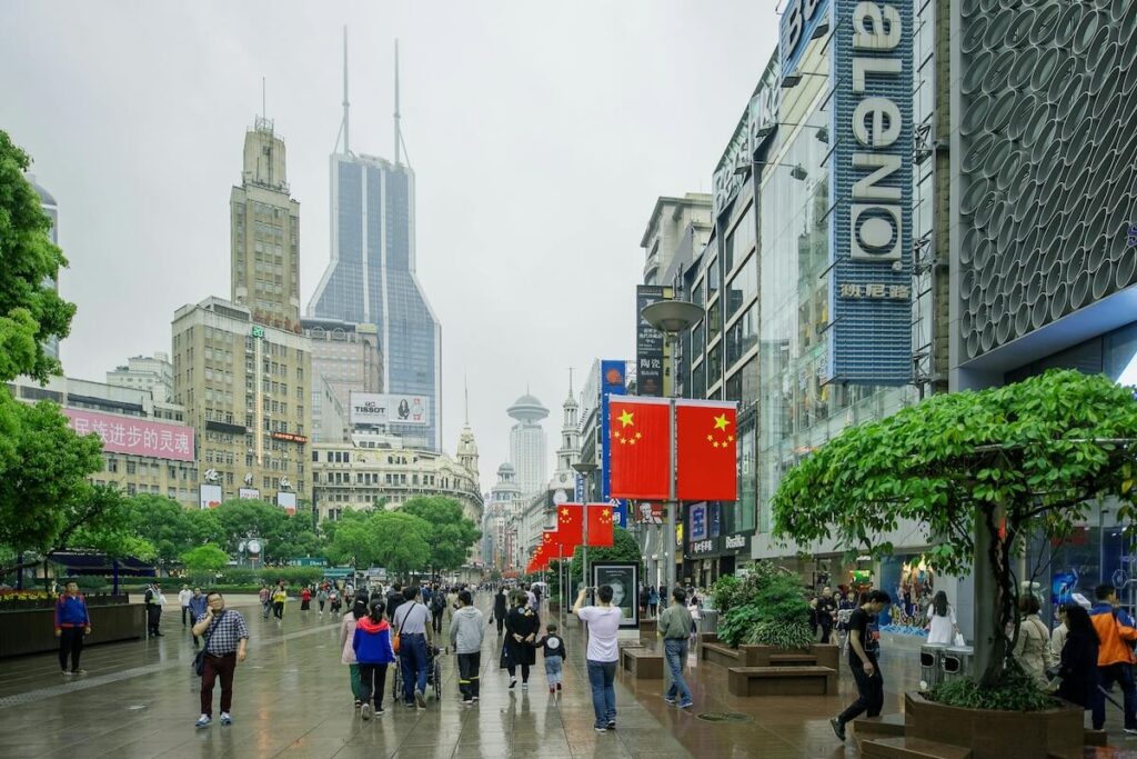 shoppers in Nanjing Road Shopping District on a foggy day