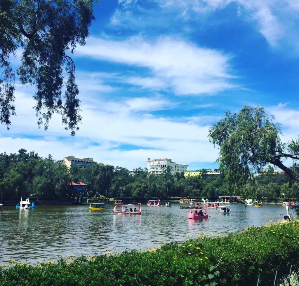 daytime scenery in Burnham Park in Baguio