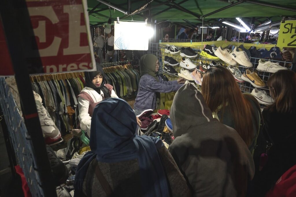shoppers around an ukay-ukay stall in Baguio