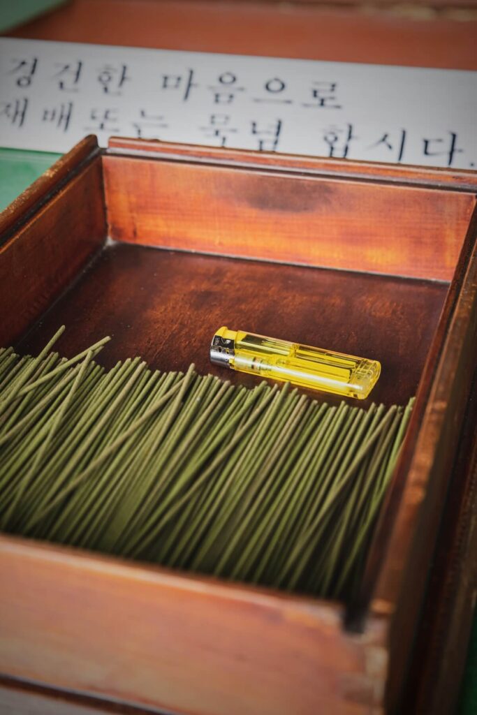 box of incense sticks with lighter