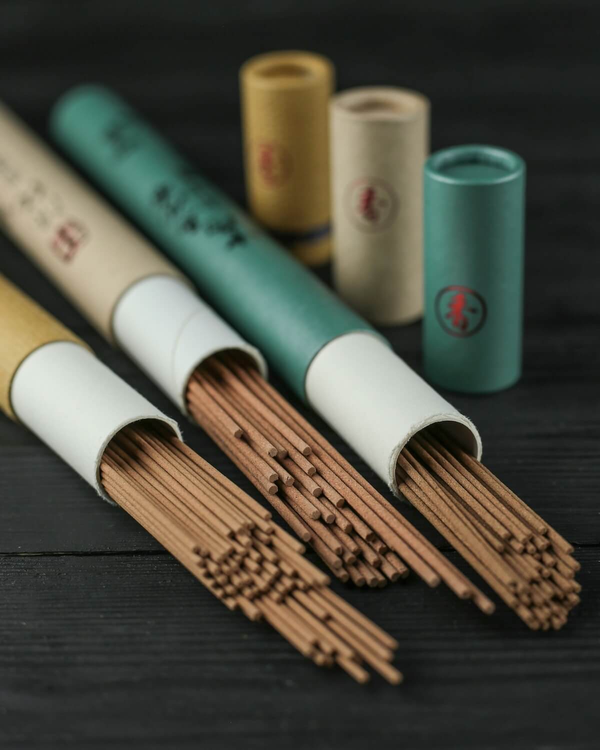 three tins of incense sticks