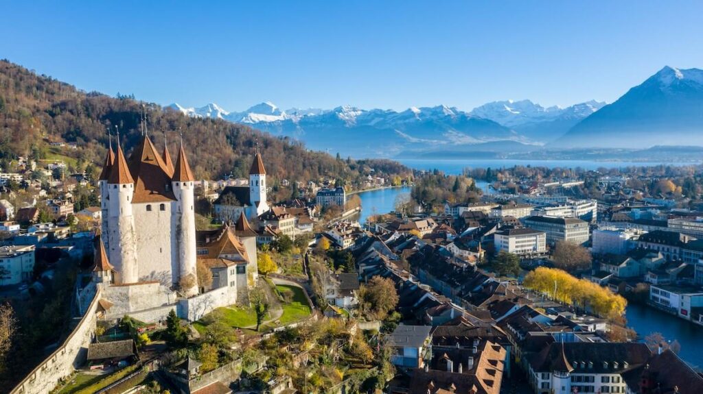 view of castle, lake, and Alps in Thun