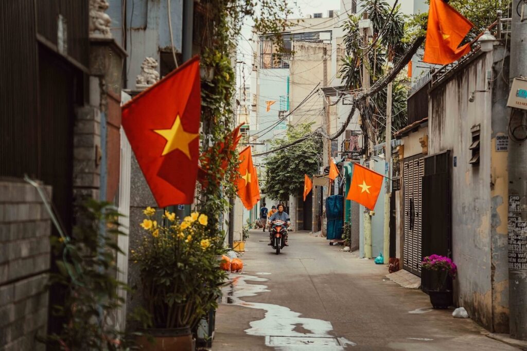 flag-filled alleyway in Ho Chi Minh City