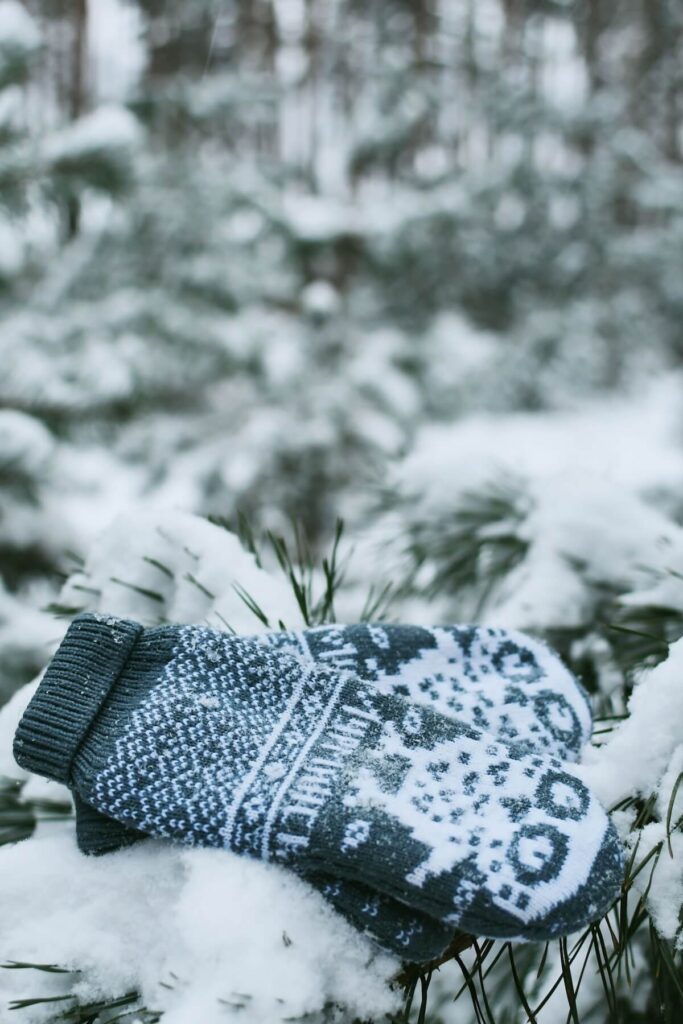 Nordic sweater mittens in snow