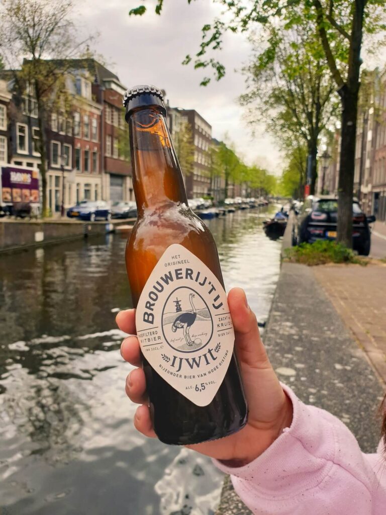 hand holding craft beer from a Dutch brewery
