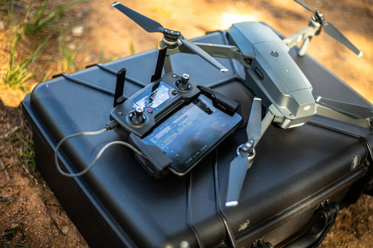 drone and controller on top of luggage
