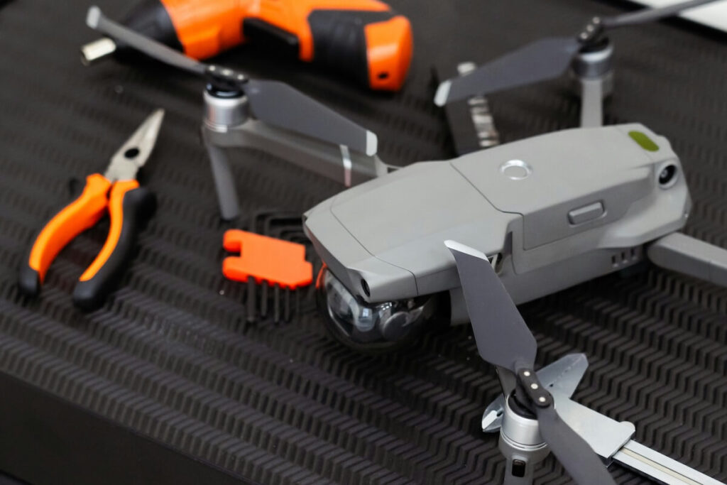 drone along with drill and pliers