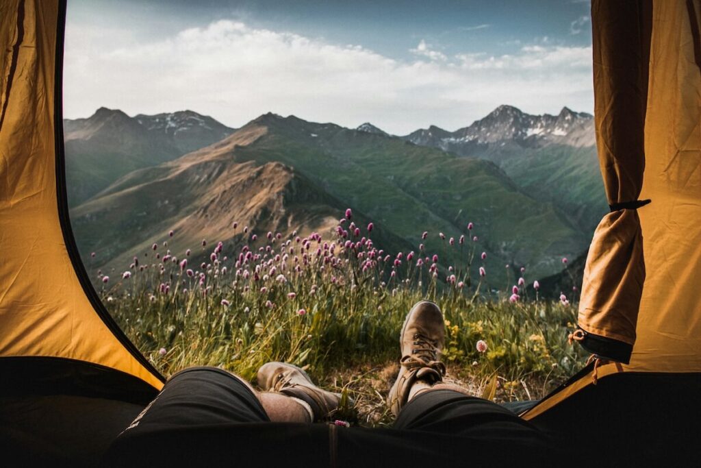man inside tent with a view of Georgia mountains