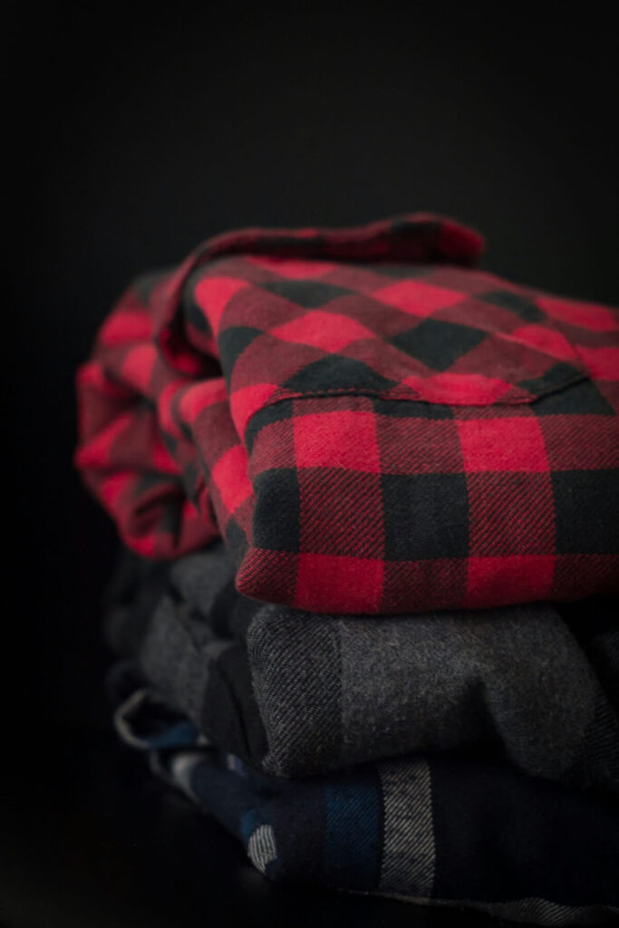 pile of plaid shirts