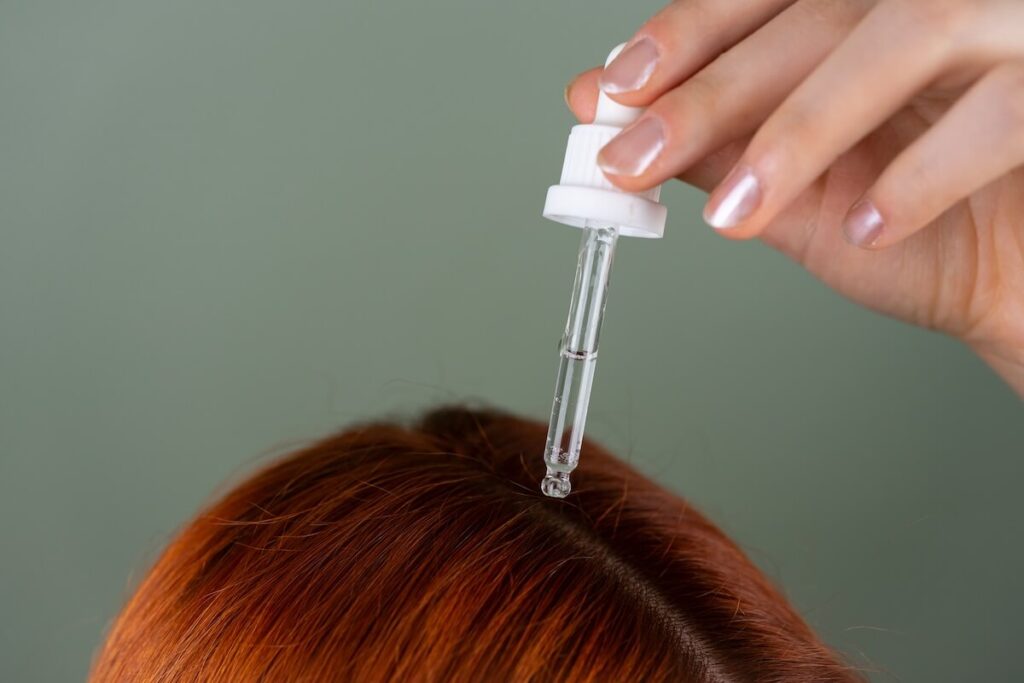 putting oil on hair